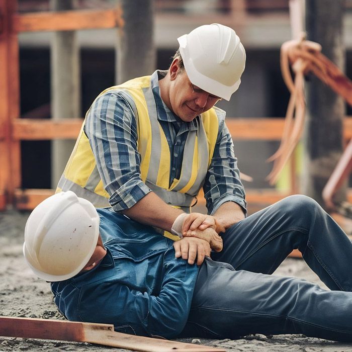 A man is working on a machine in a factory.
