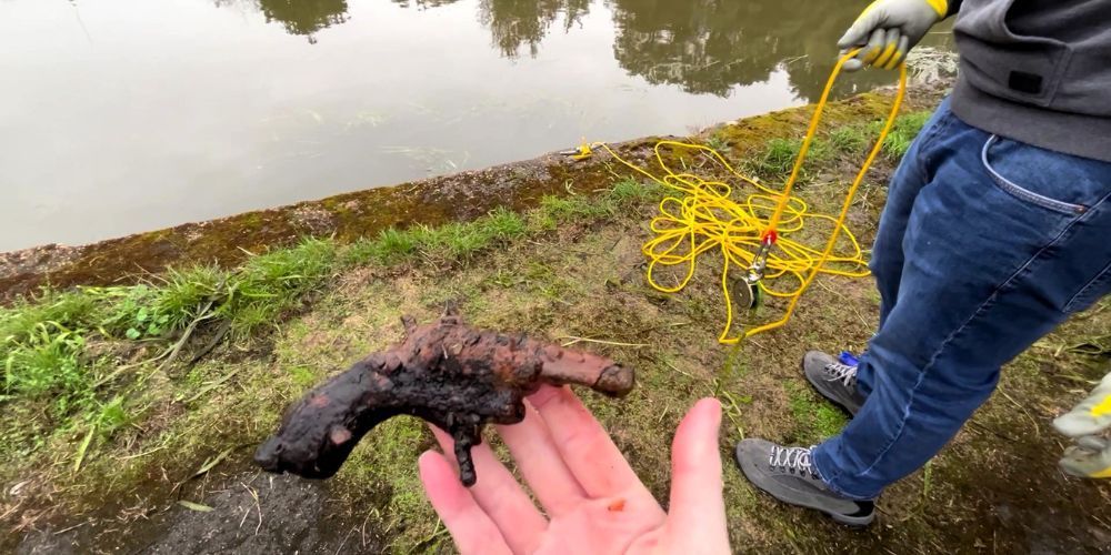 a rusty gun found magnet fishing