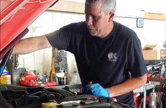 Coggins Owner Checking Car Hood — Hendersonville, NC — Coggins Transmissions/Fieler Automotive Inc.