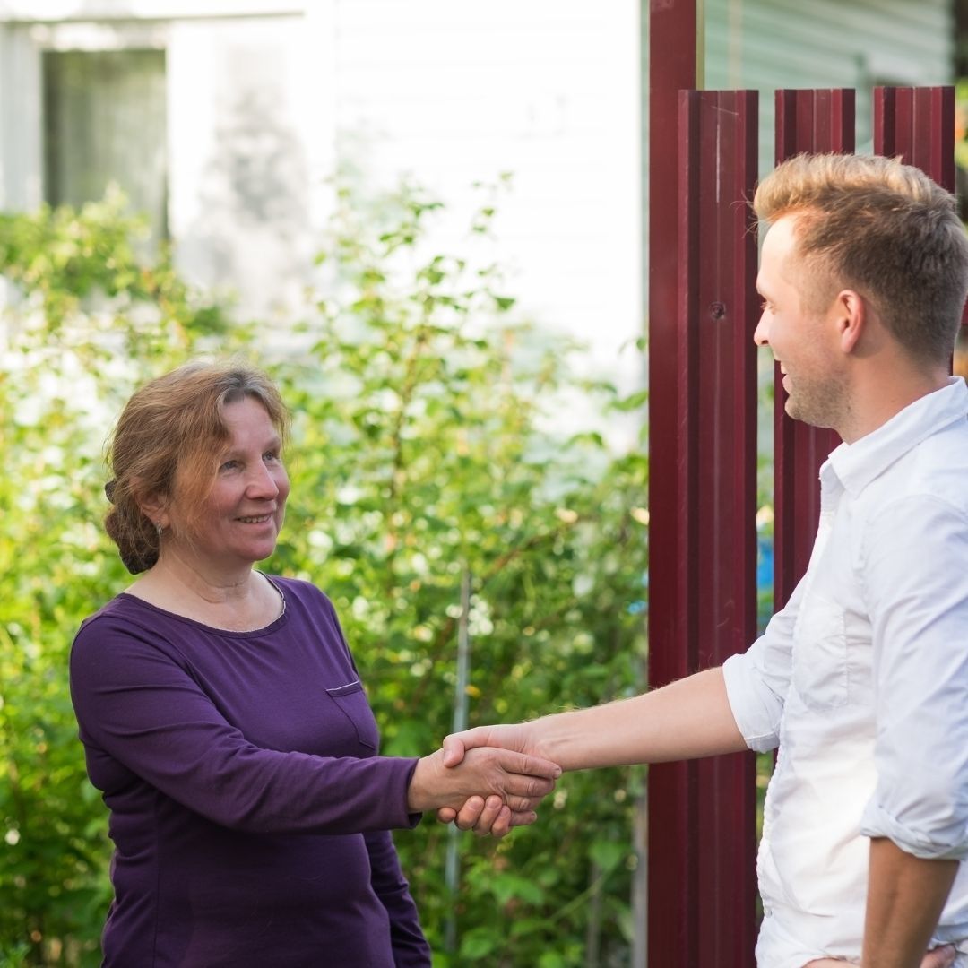 neighbors shaking hands