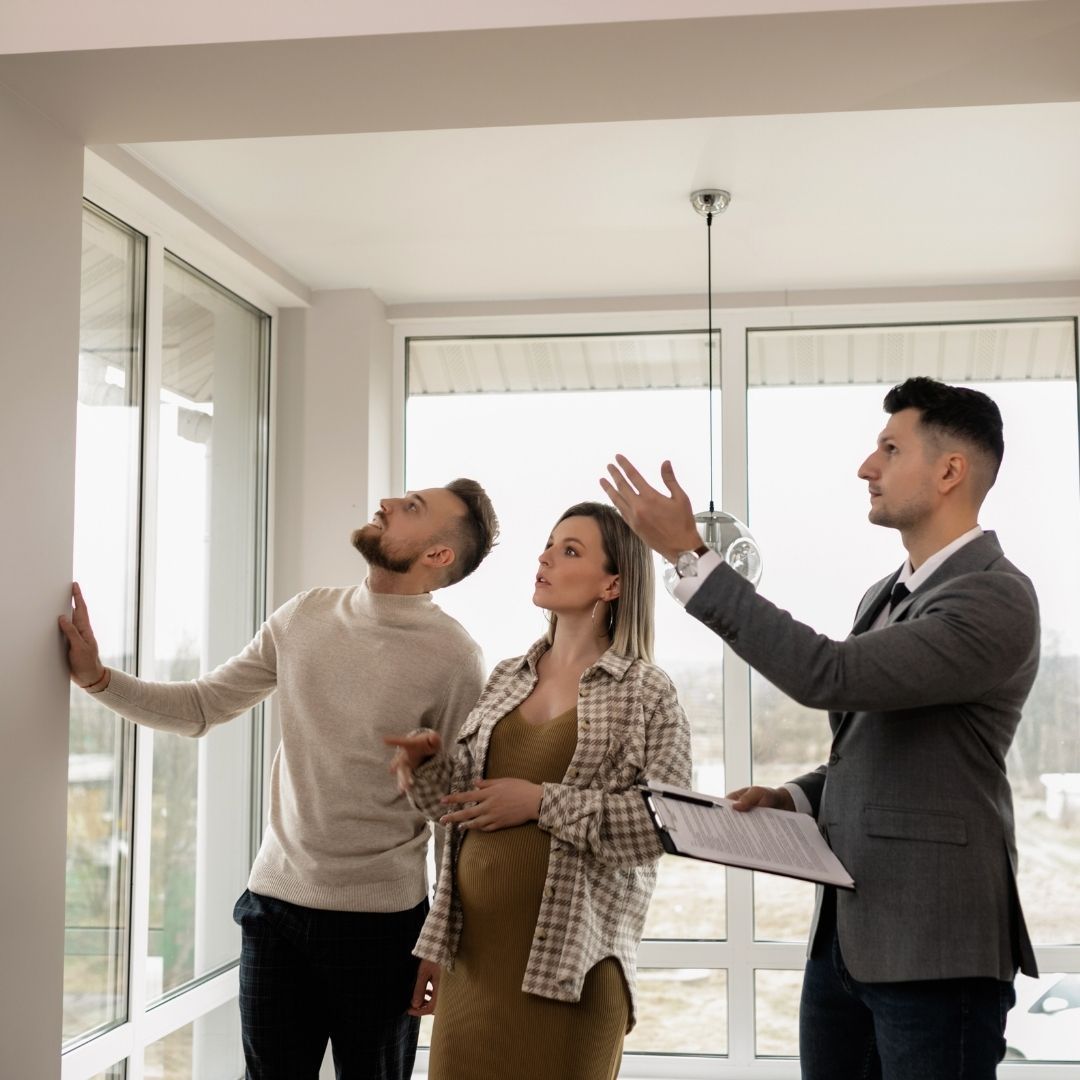 a couple looking at a house