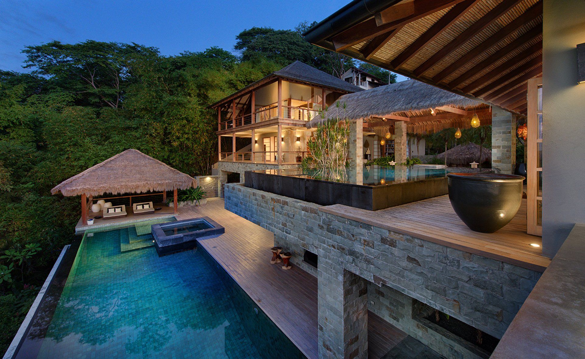 A large house with a swimming pool in front of it