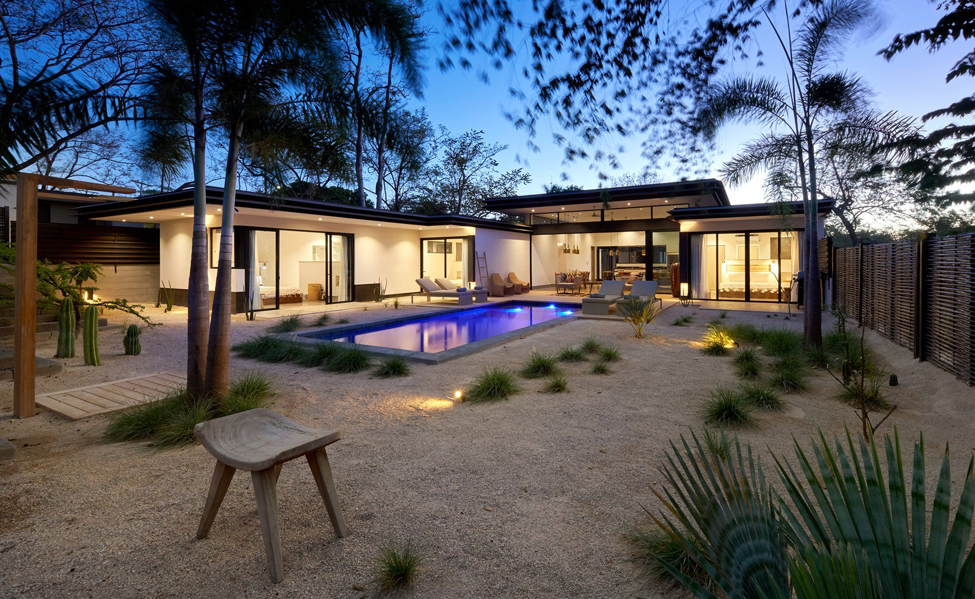 A large house with a swimming pool in the backyard