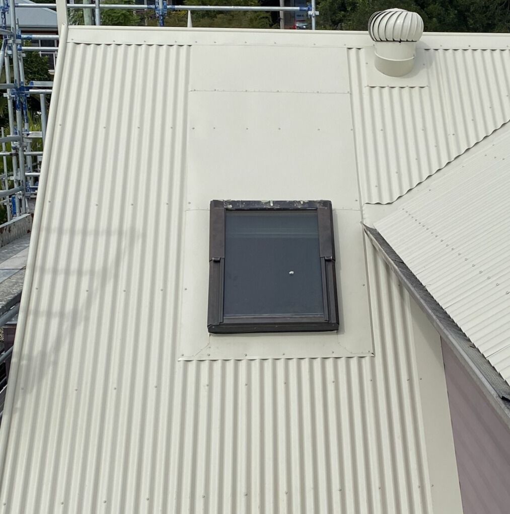 A Skylight Is Open On The Roof Of A House — Glenroofing Pty Ltd In Taree, NSW