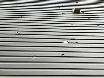 A Close Up Of A Black And Red Roof — Glenroofing Pty Ltd In Taree, NSW