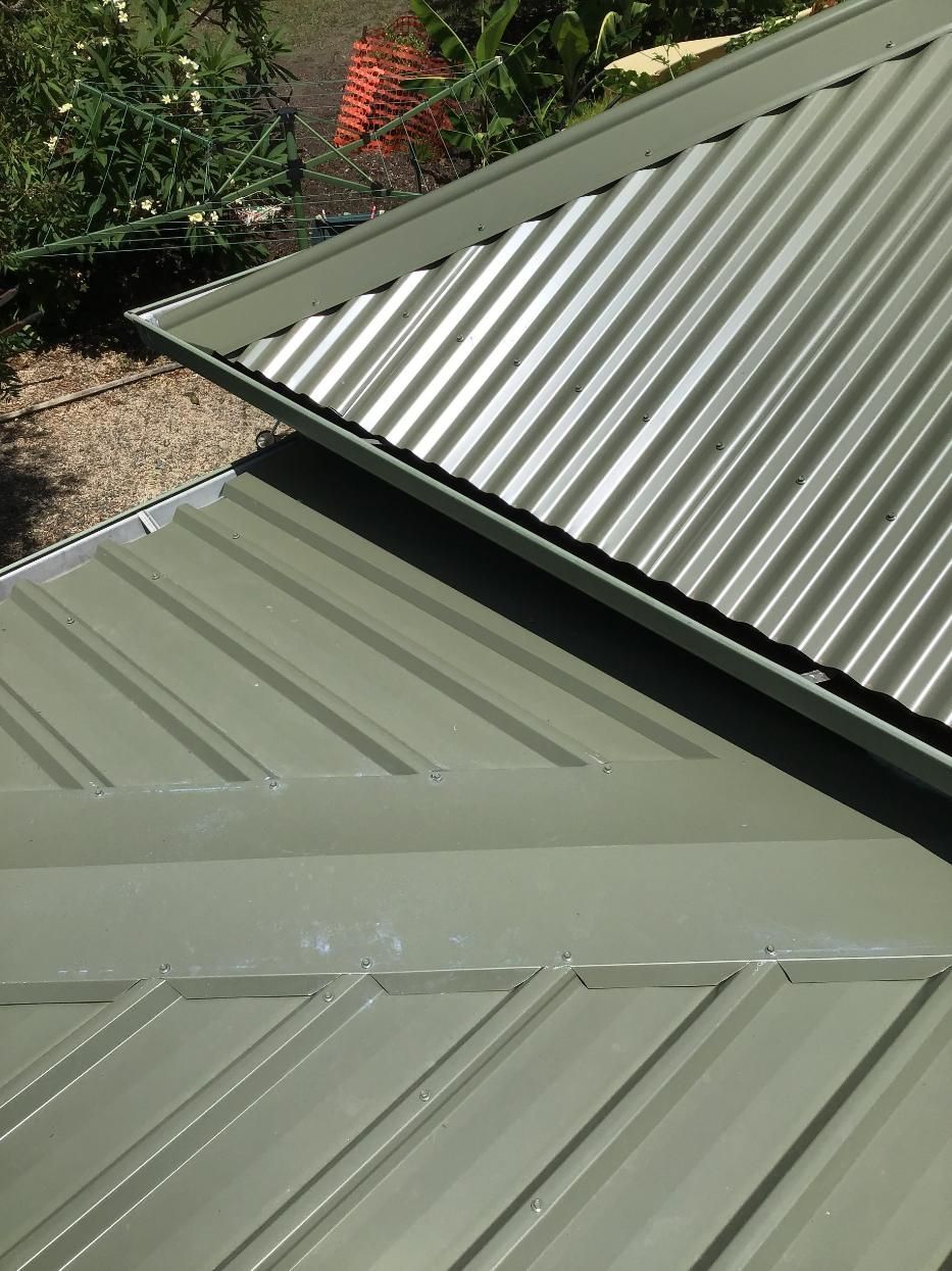 A Close Up Of A Green Corrugated Metal Roof On A House — Glenroofing Pty Ltd In Taree, NSW