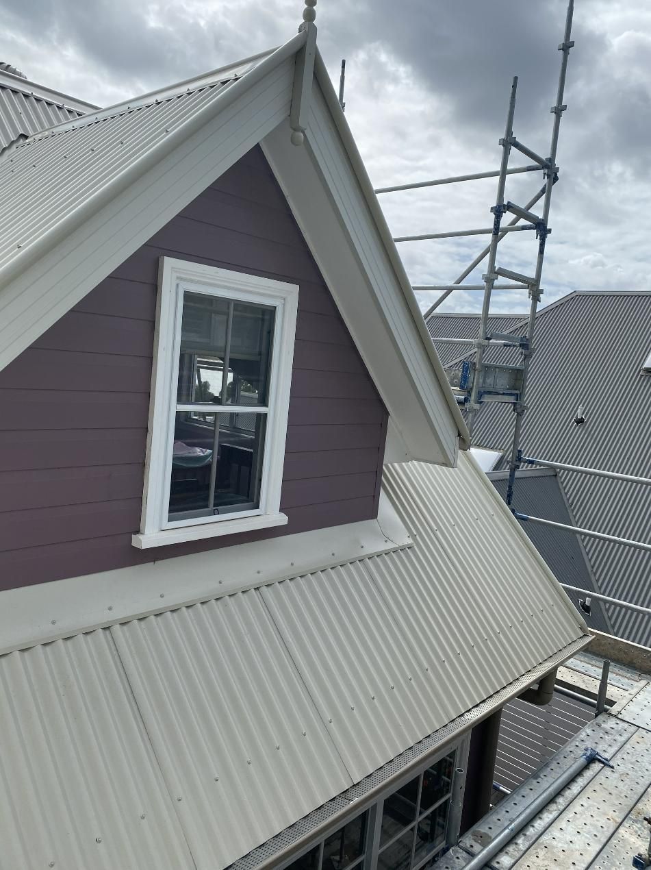A House With A White Roof And A Window On The Side — Glenroofing Pty Ltd In Forster, NSW