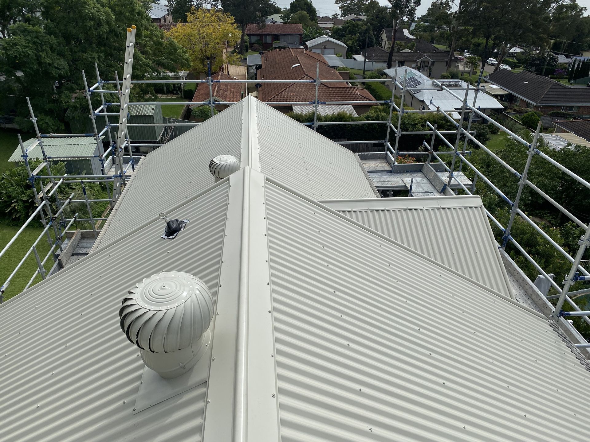 A metal roof recently insulated with anticon insulation blanket — Glenroofing Pty Ltd In Taree, NSW