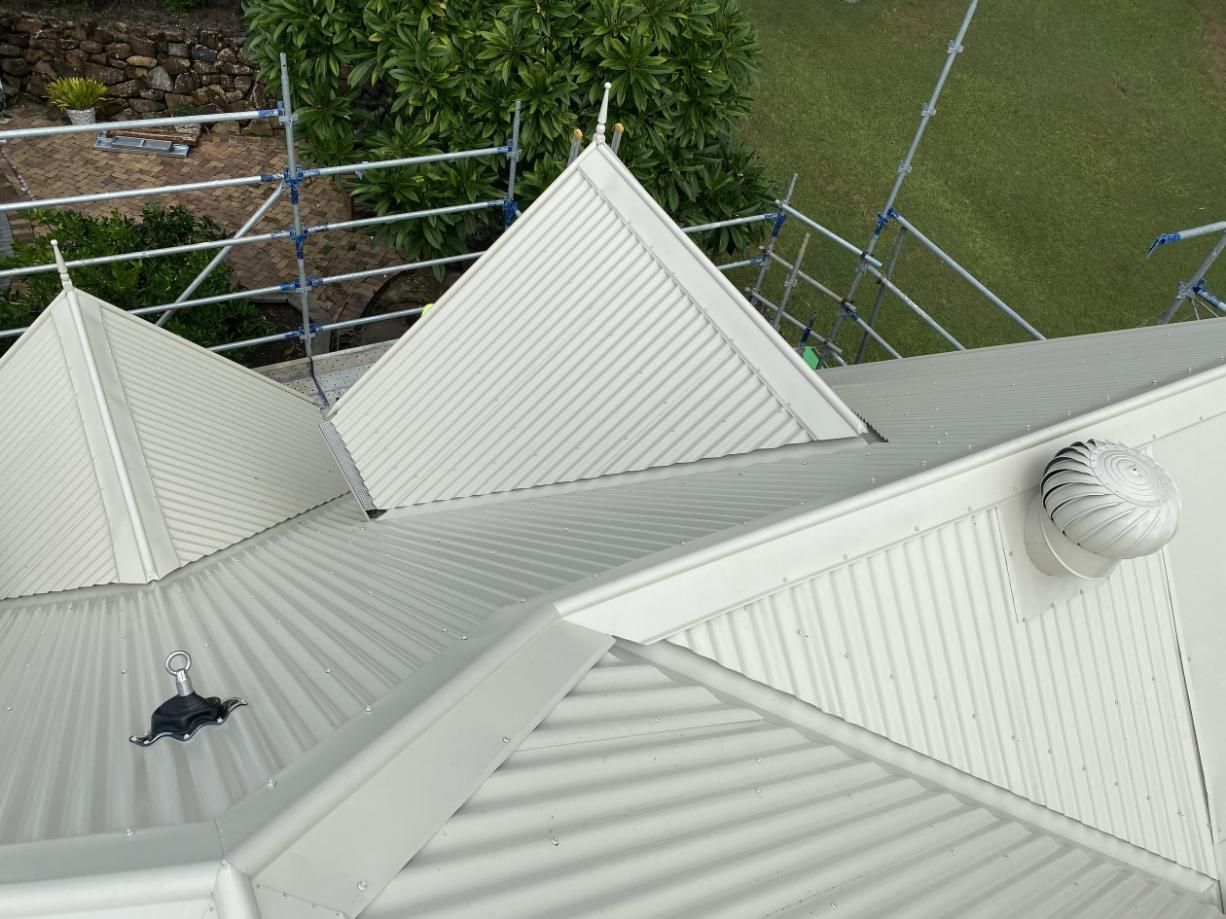 An Aerial View Of A White Roof With Scaffolding Around It — Glenroofing Pty Ltd In Kempsey, NSW
