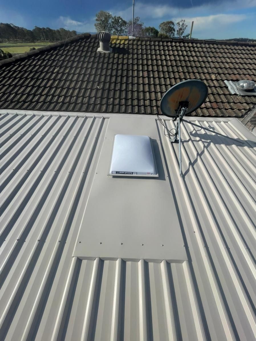 A White Roof With A Satellite Dish On It — Glenroofing Pty Ltd In Taree, NSW