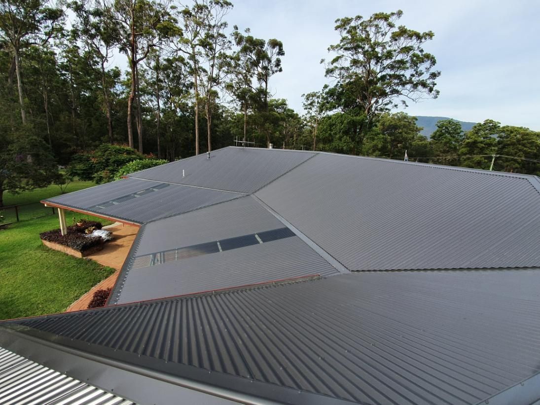 An Aerial View Of A Roof Of A House With Trees In The Background — Glenroofing Pty Ltd In Taree, NSW
