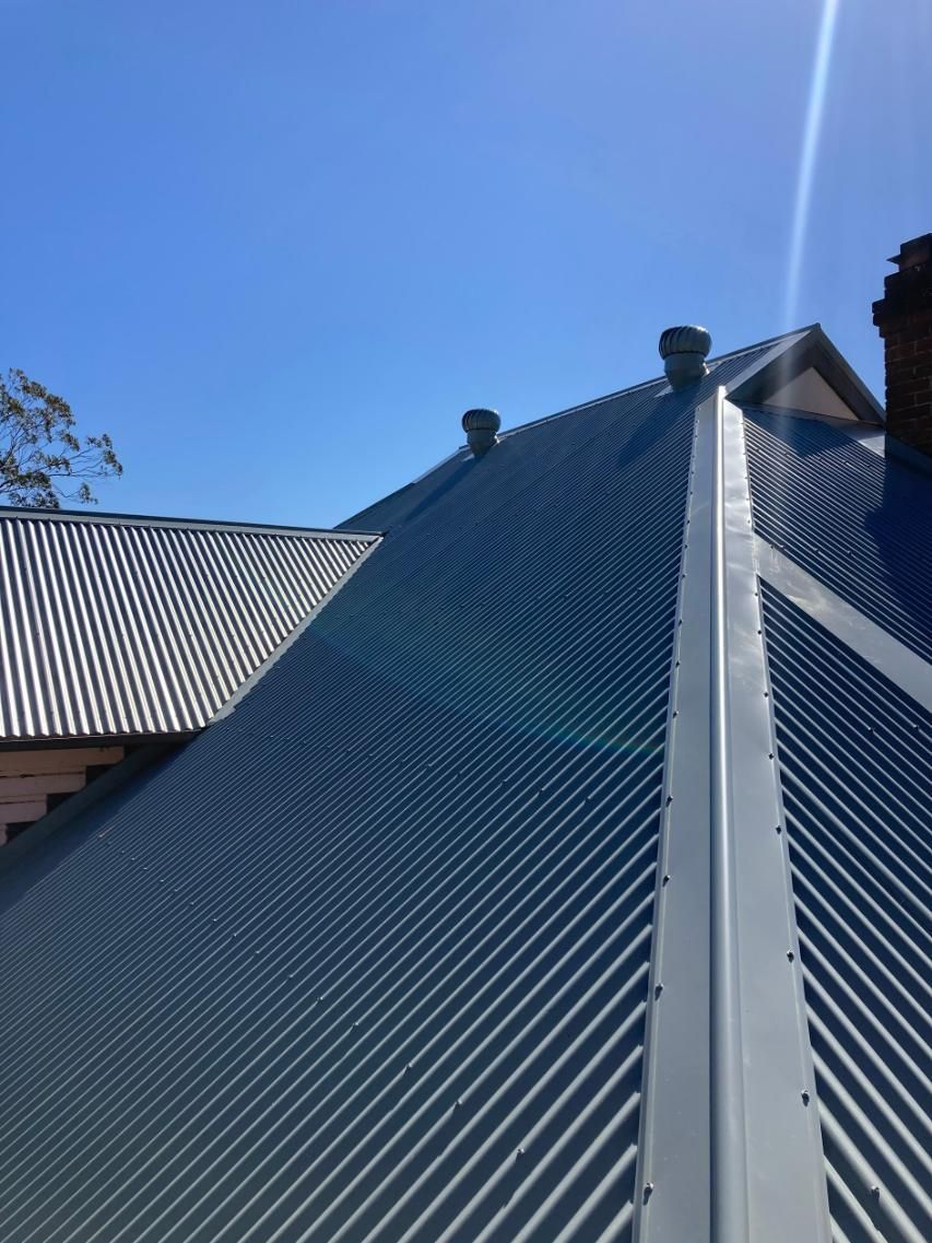 A Close Up Of A Roof With A Blue Sky In The Background — Glenroofing Pty Ltd In Taree, NSW