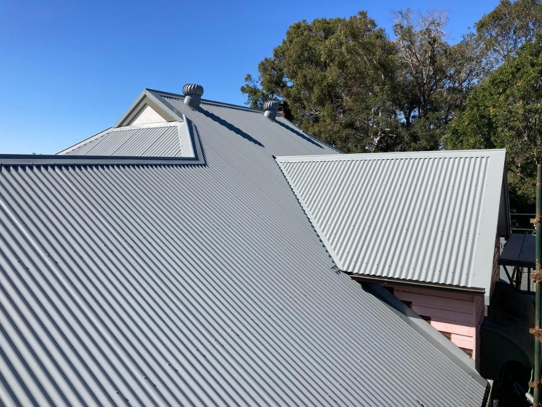 A Close Up Of A Roof With A Blue Sky In The Background — Glenroofing Pty Ltd In Taree, NSW