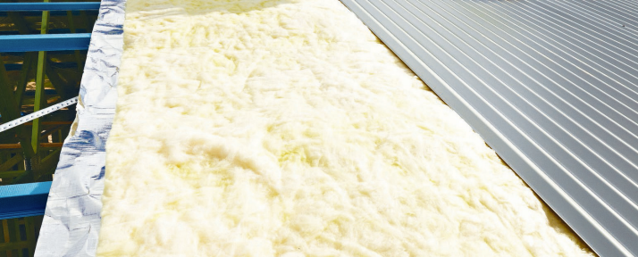 A Room With A Roof Window And Foam Insulation On The Ceiling — Glenroofing Pty Ltd In Taree, NSW