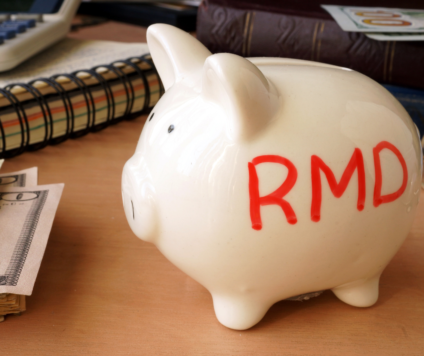 A piggy bank with the word RMD written on it