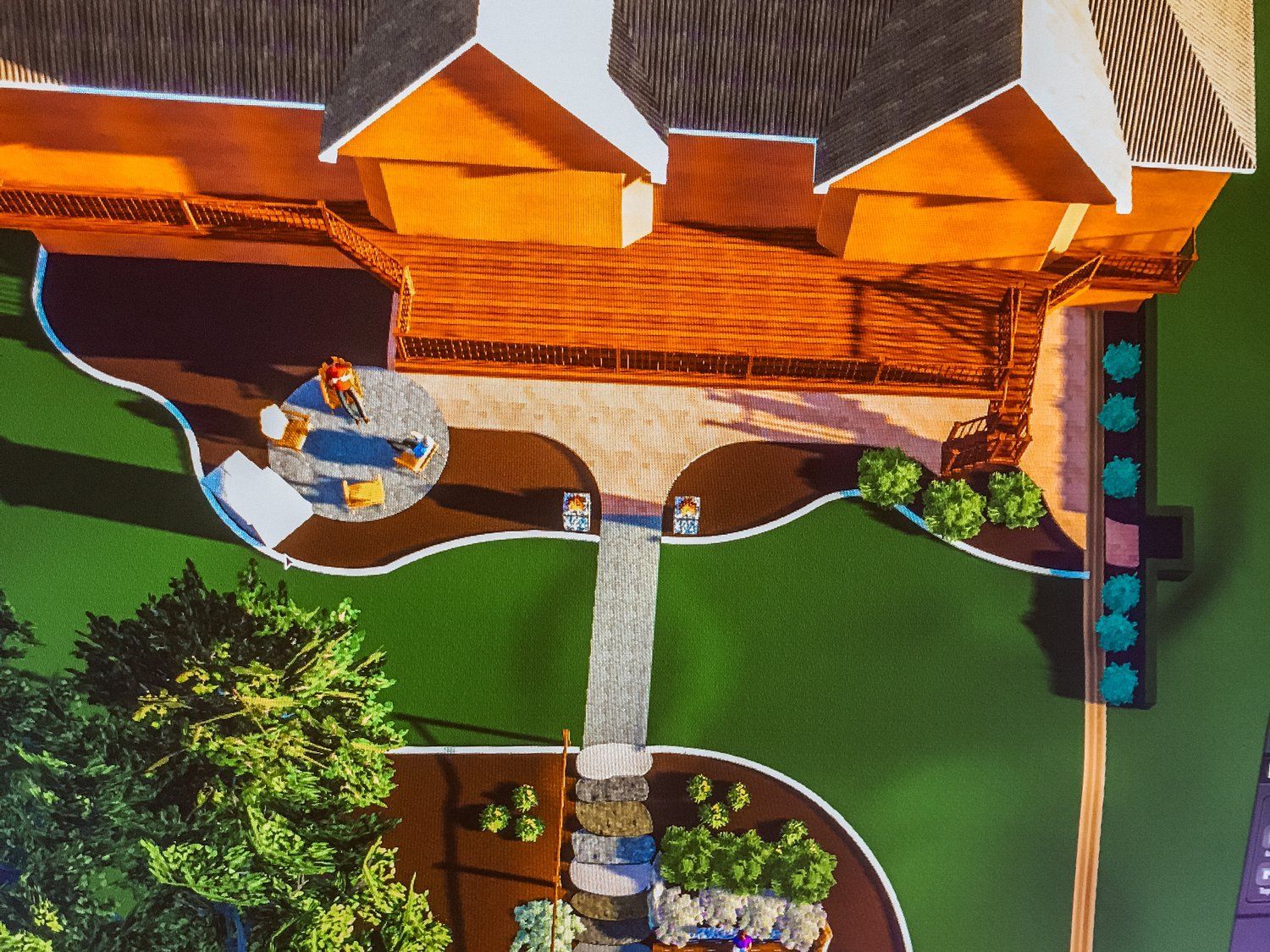 An aerial view of a backyard with a house in the background