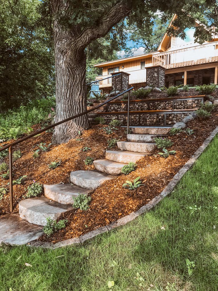 A set of stairs leading up to a house on a hill.
