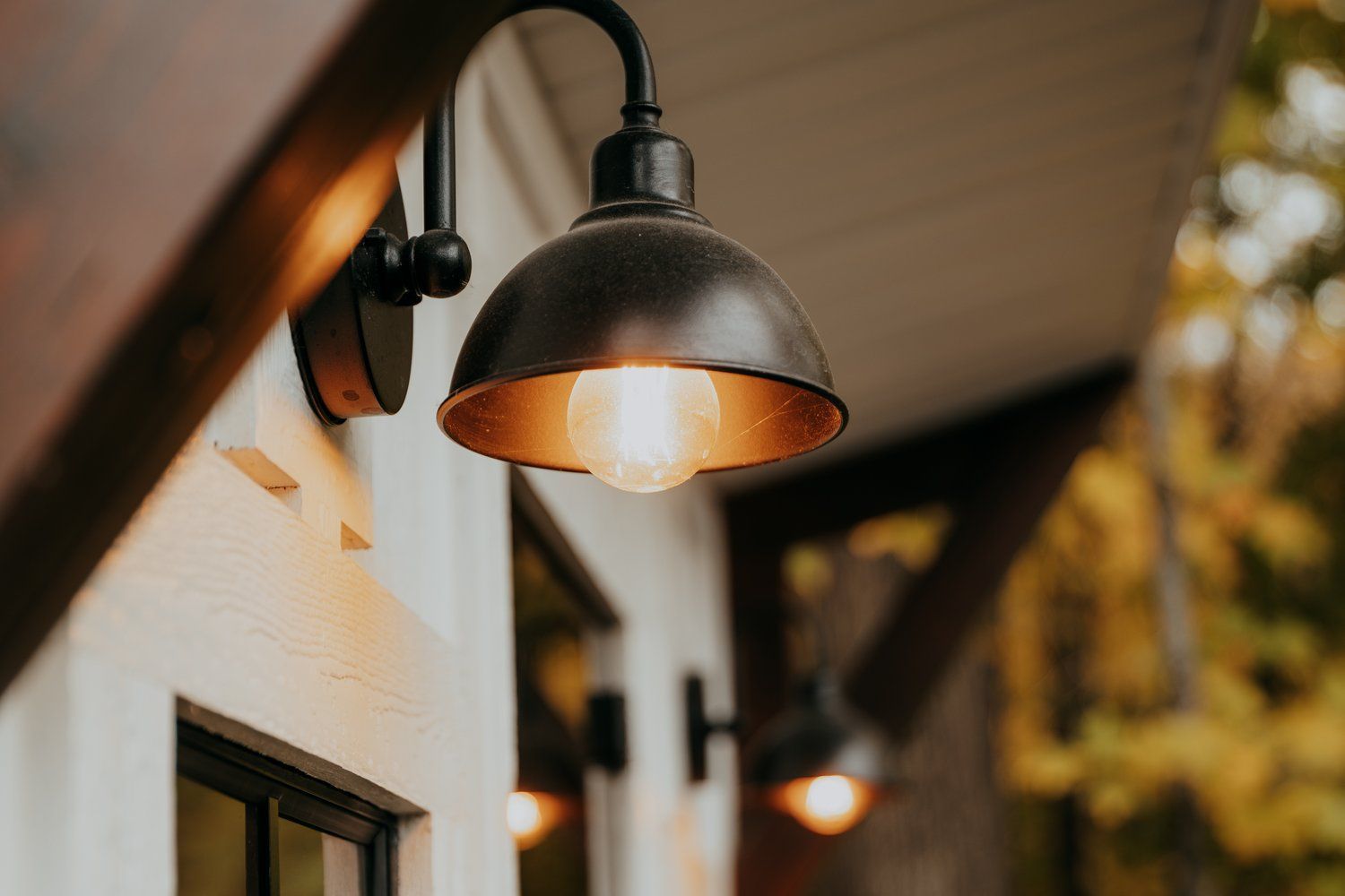 A close up of a light on the side of a building.