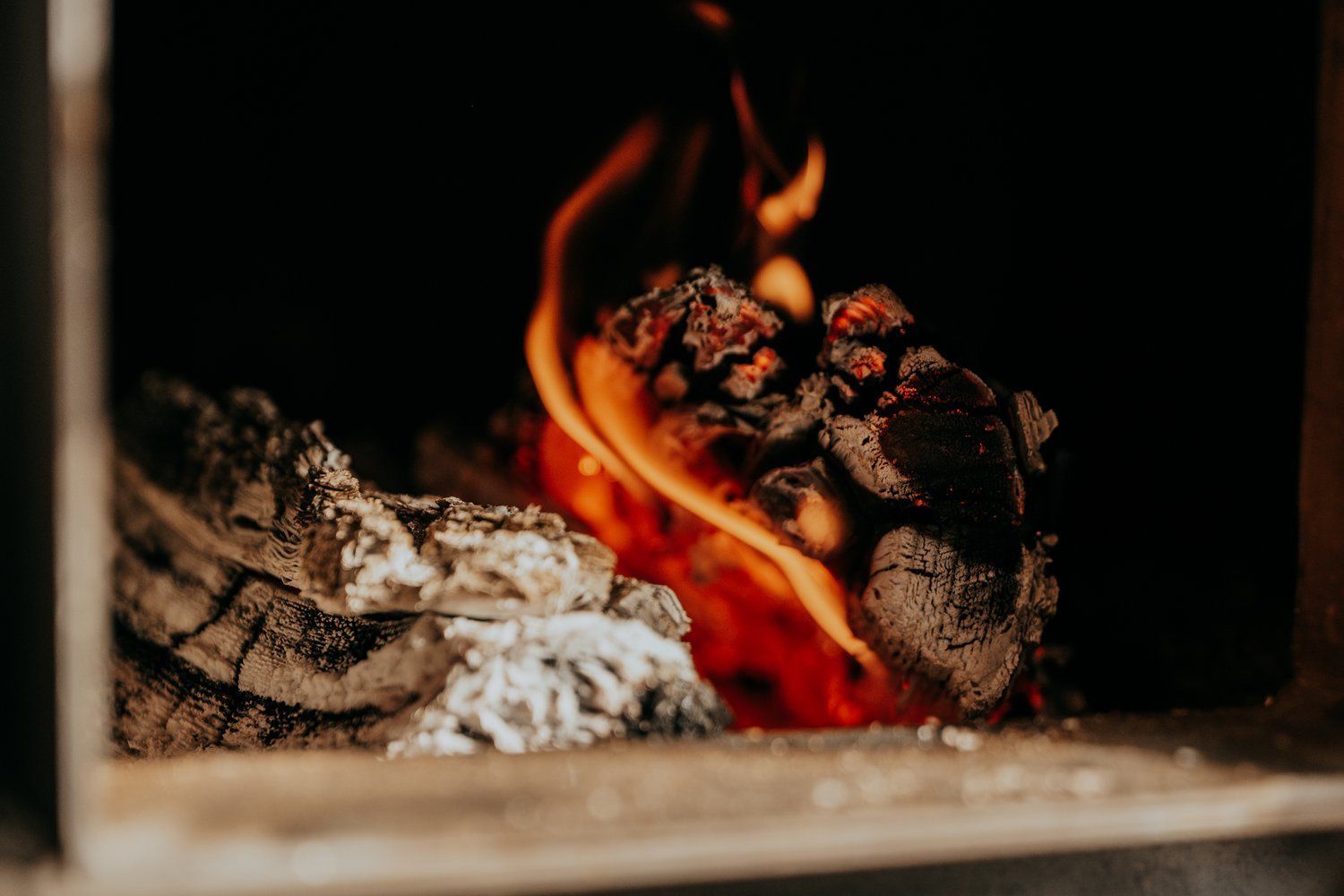 A close up of a fire in a fireplace.