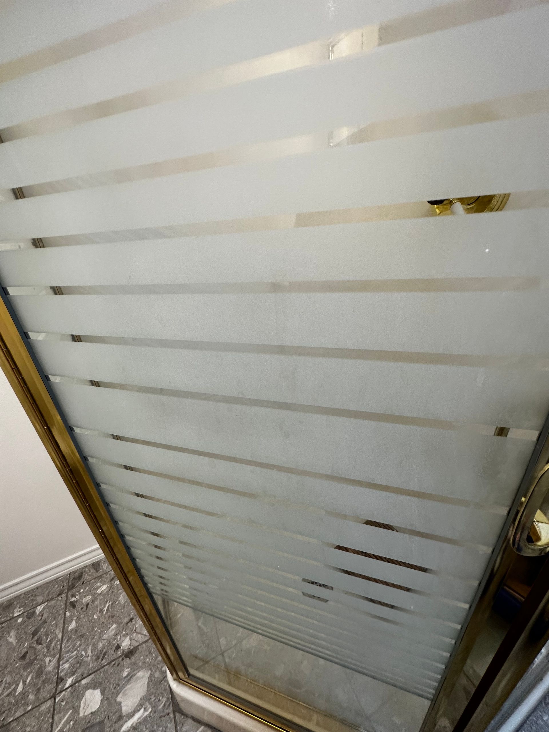 A close up of a glass door with stripes on it