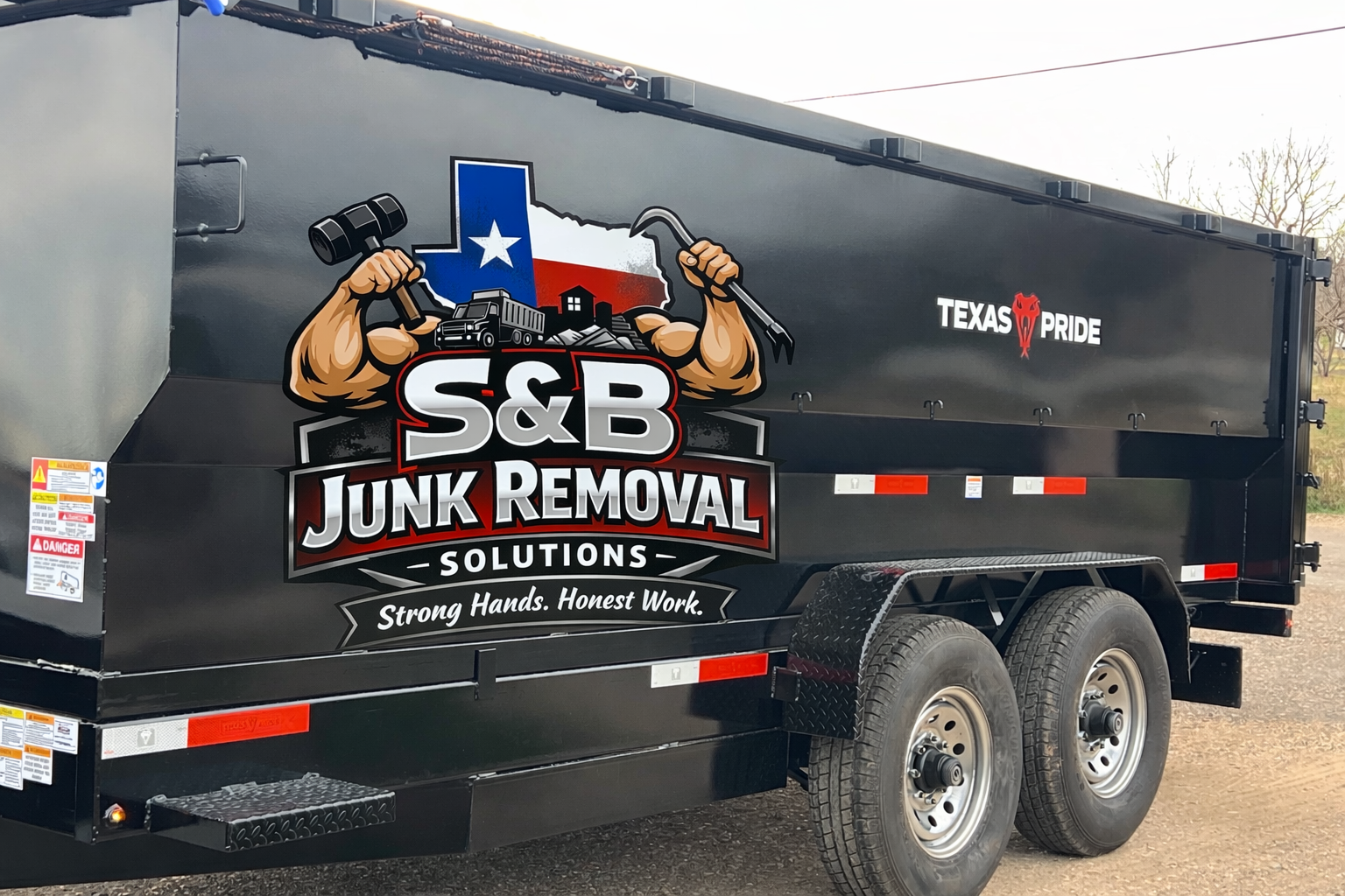 Black S&B Junk Removal trailer with Texas logo.