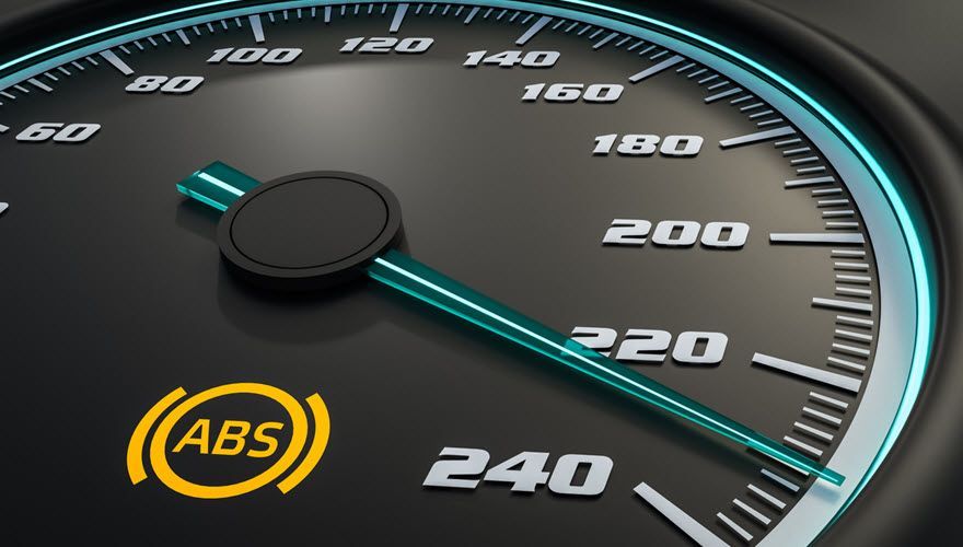 A close up of a speedometer that says abs on it | Import Specialty Service