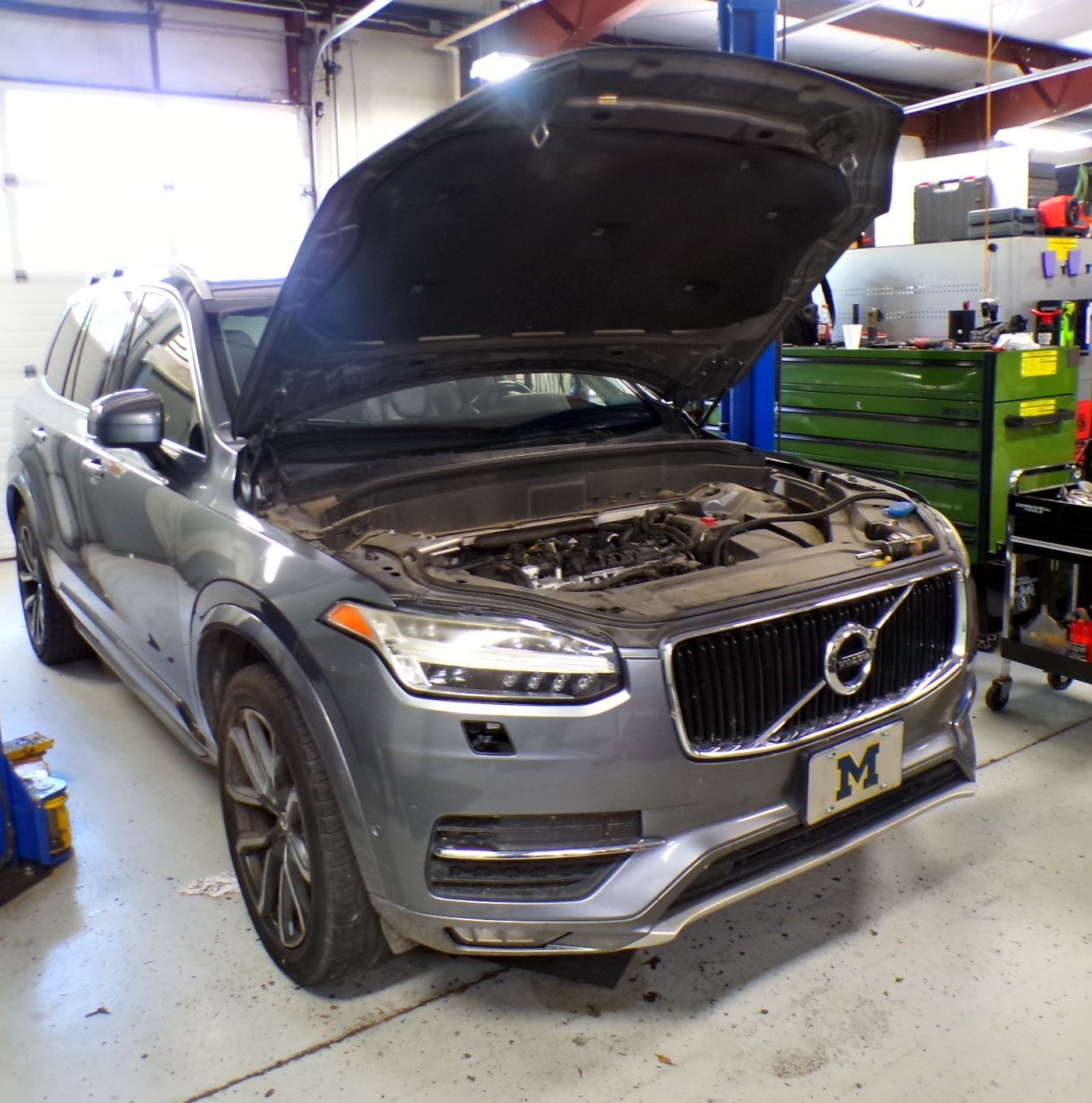 A volvo with the hood up in a garage | Import Specialty Service