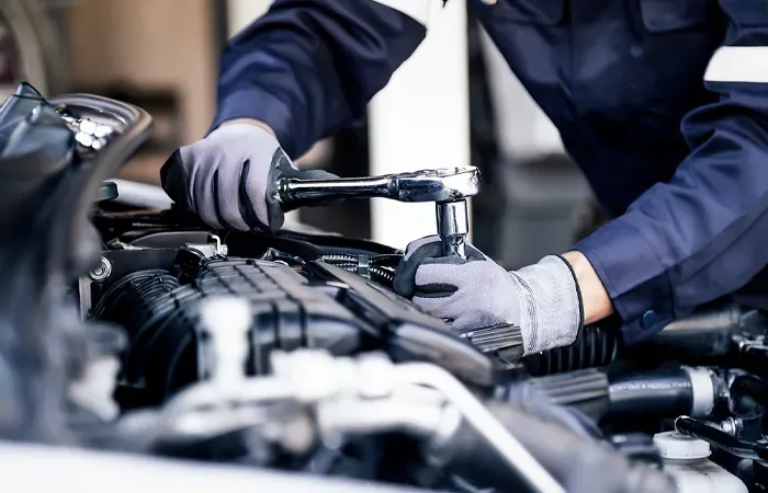 Technician working on engine | Import Specialty Service