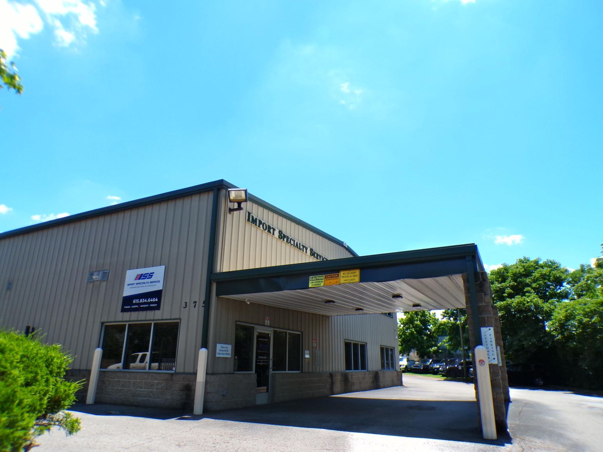 A large building with a sign that says ' united states postal service ' on it | Import Specialty Service