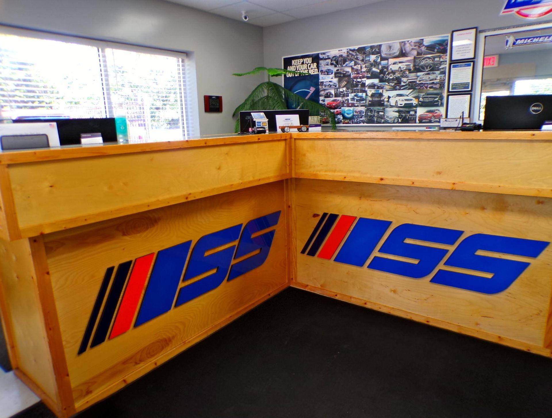 A wooden counter with the word iss on it | Import Specialty Service