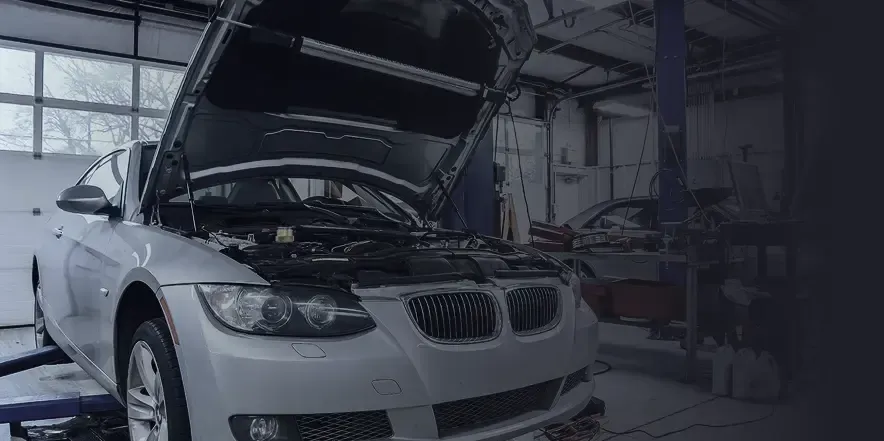 A silver car with its hood open inside our garage in Nashville, TN | Import Specialty Service