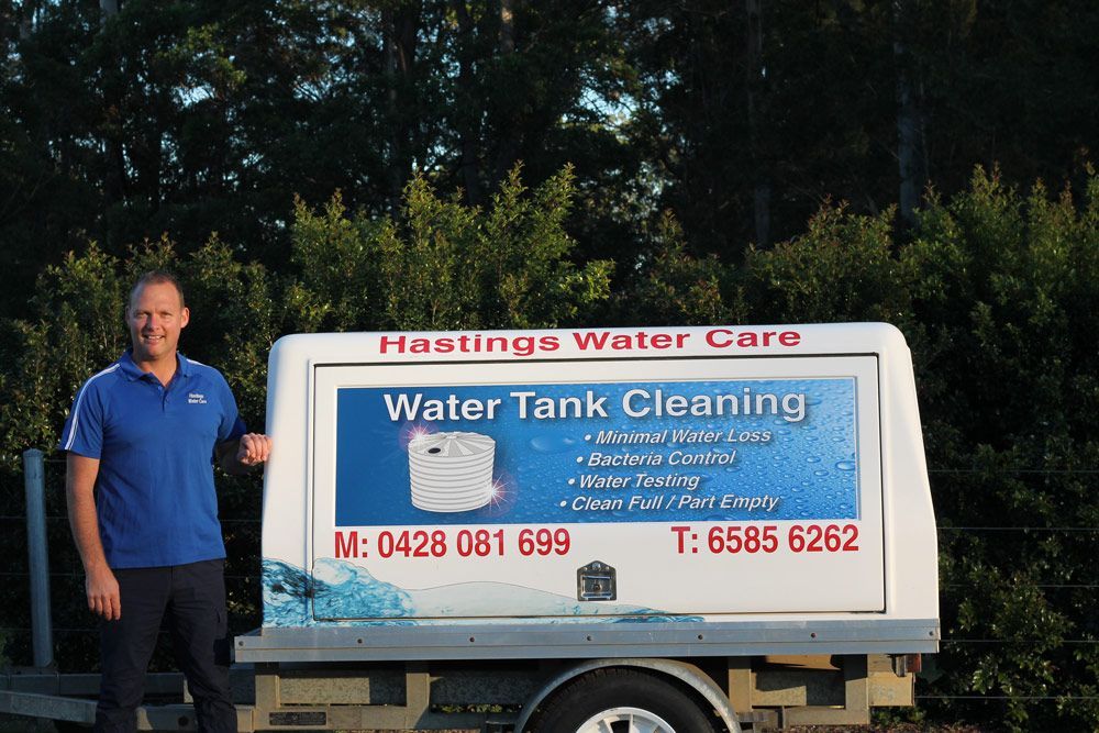 A man standing next to a trailer — Hastings Water Care In Redbank, NSW