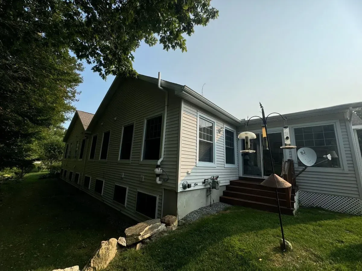A large house with a lot of windows and stairs