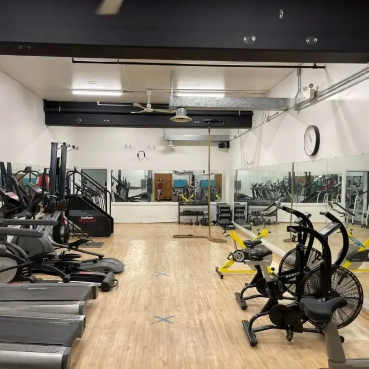 A gym filled with treadmills and exercise bikes