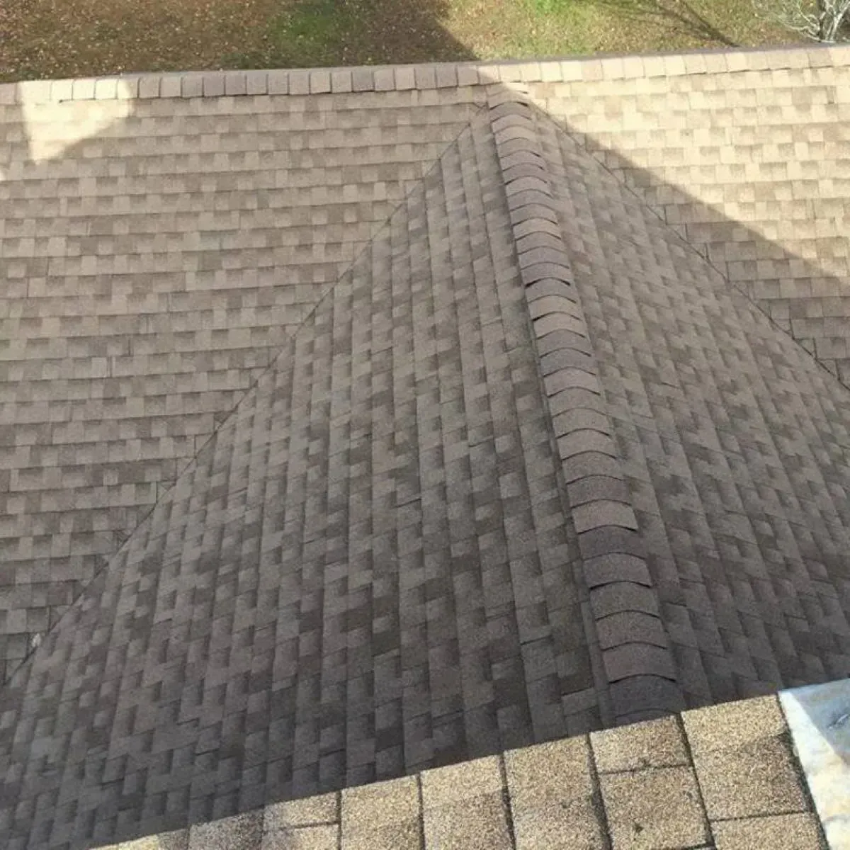 A close up of a roof with shingles on it.