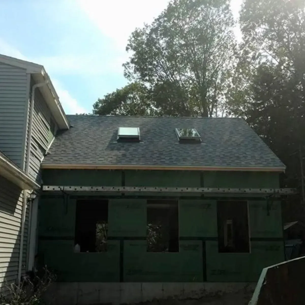 A house with a roof that has a skylight on it