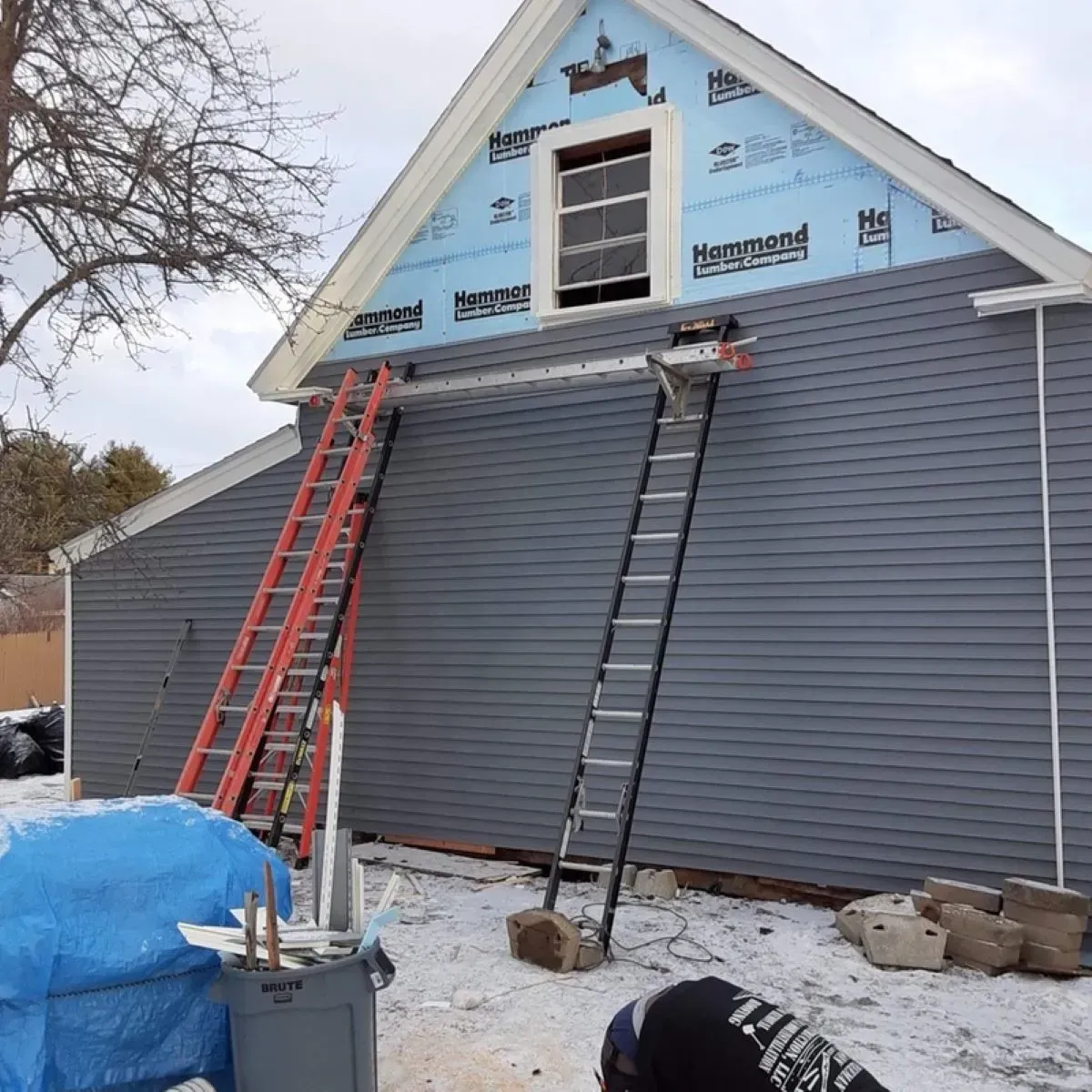 A ladder is attached to the side of a house