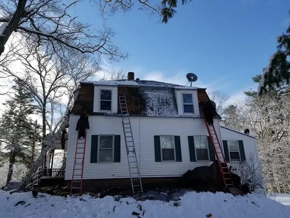 A house with a satellite dish on top of it