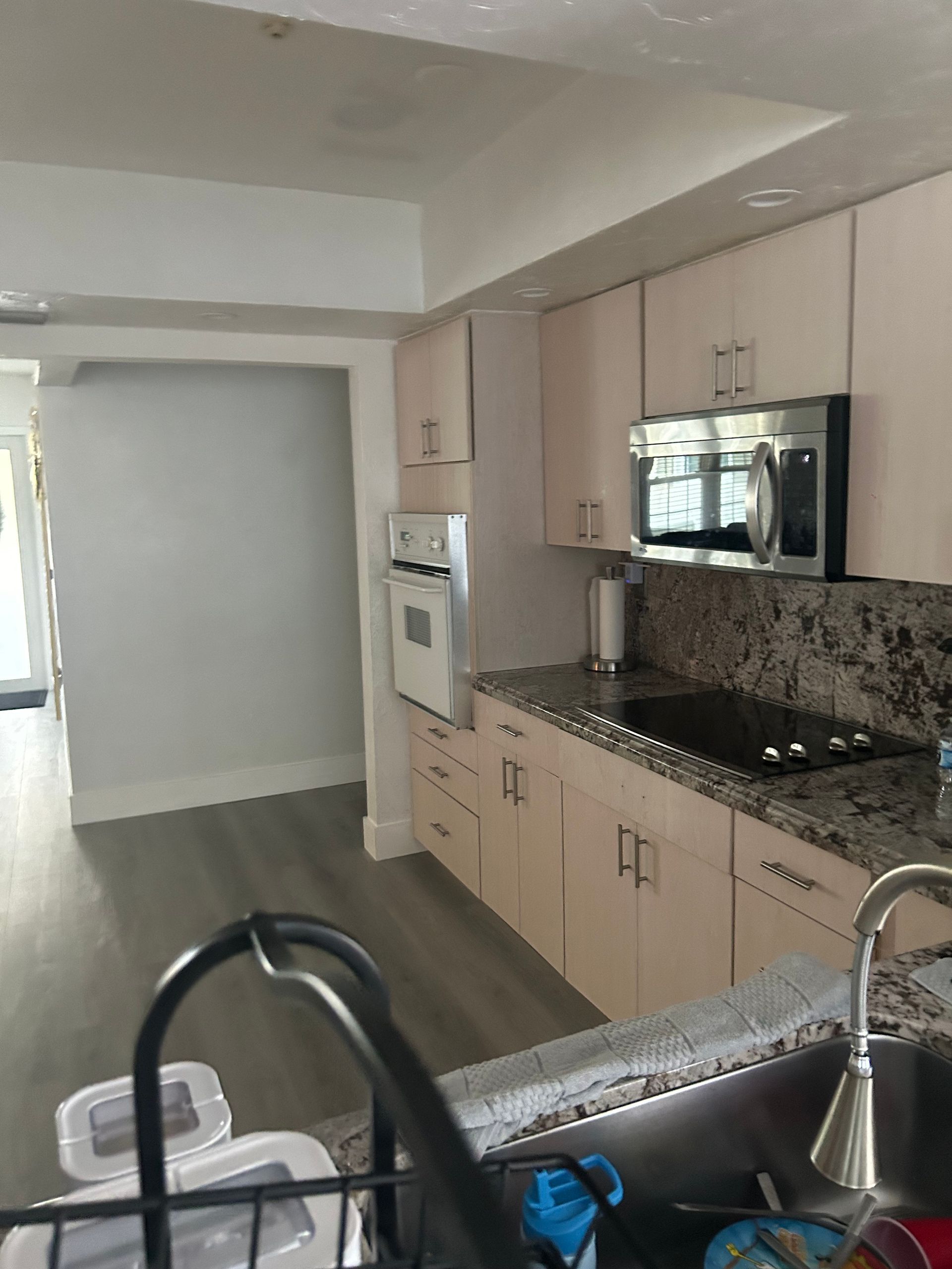 A kitchen with stainless steel appliances and granite counter tops