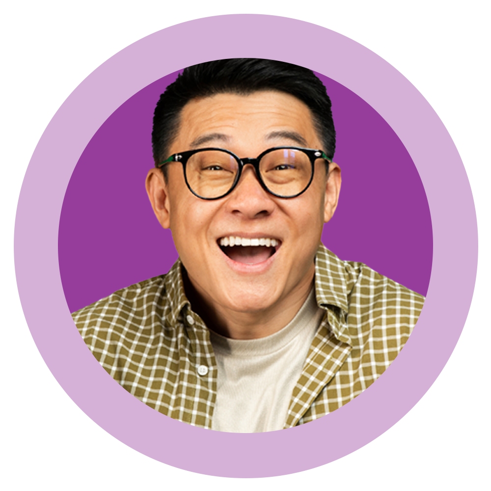 A man wearing glasses and a plaid shirt is smiling in a purple circle.