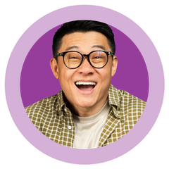 A man wearing glasses and a plaid shirt is smiling in a purple circle.