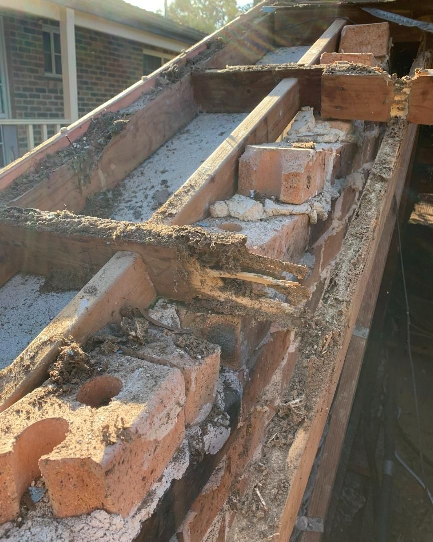A Brick Wall With A Lot Of Bricks On It — Nique Building In Gosford, NSW