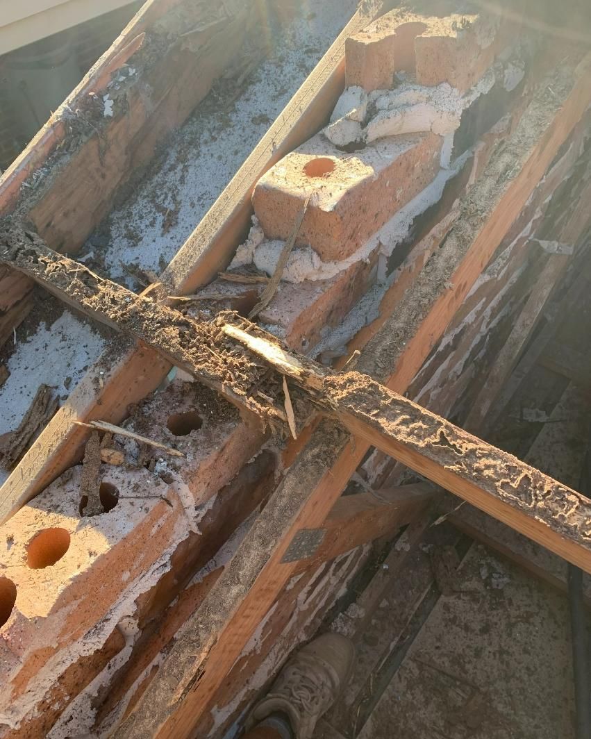 A Pile Of Wood And Bricks Laying On Top Of Each Other — Nique Building In Erina Heights, NSW