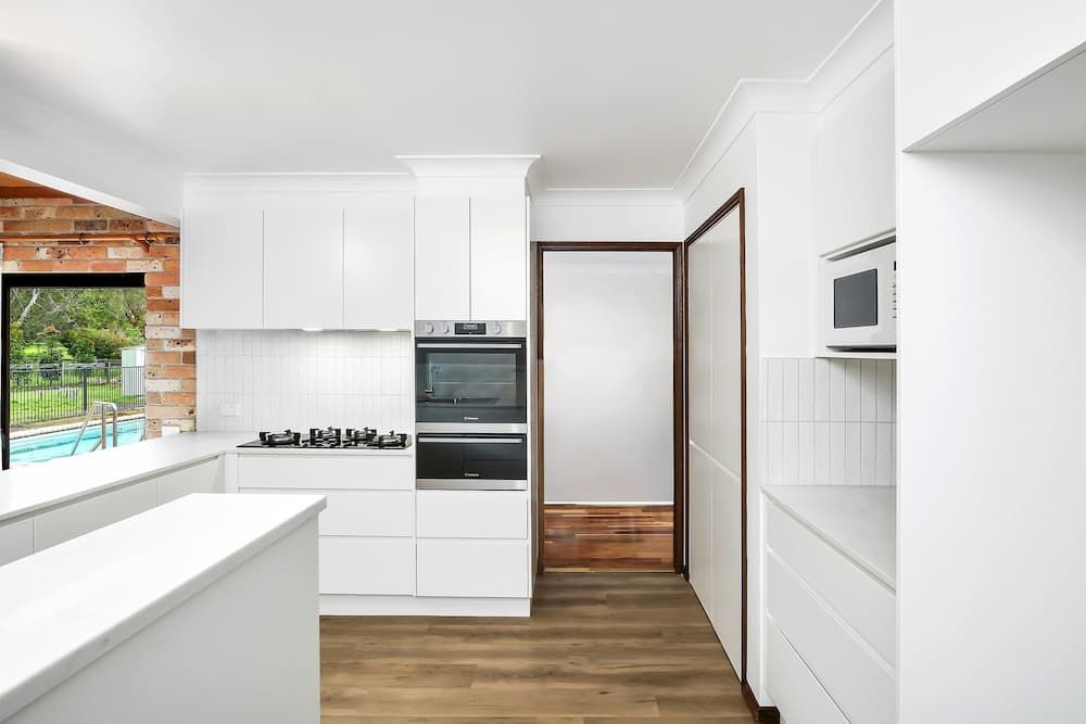 Modern Kitchen With White Cabinetry