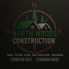 Logo for North Woods Construction with a compass, trees, and roof imagery, plus service list and phone numbers.