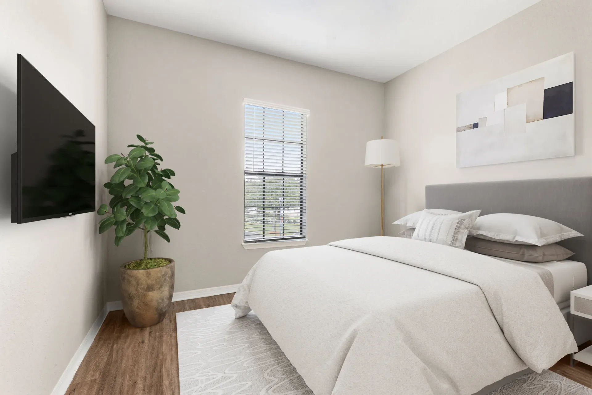 A bedroom with a large bed and a flat screen TV mounted on the wall.