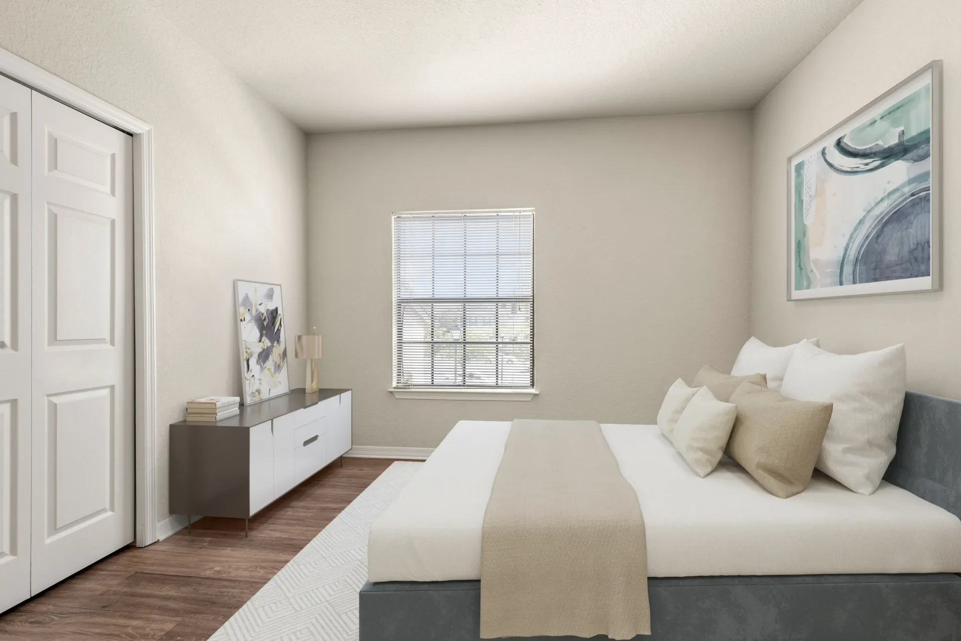 A bedroom with a bed, nightstand, and a window with blinds.