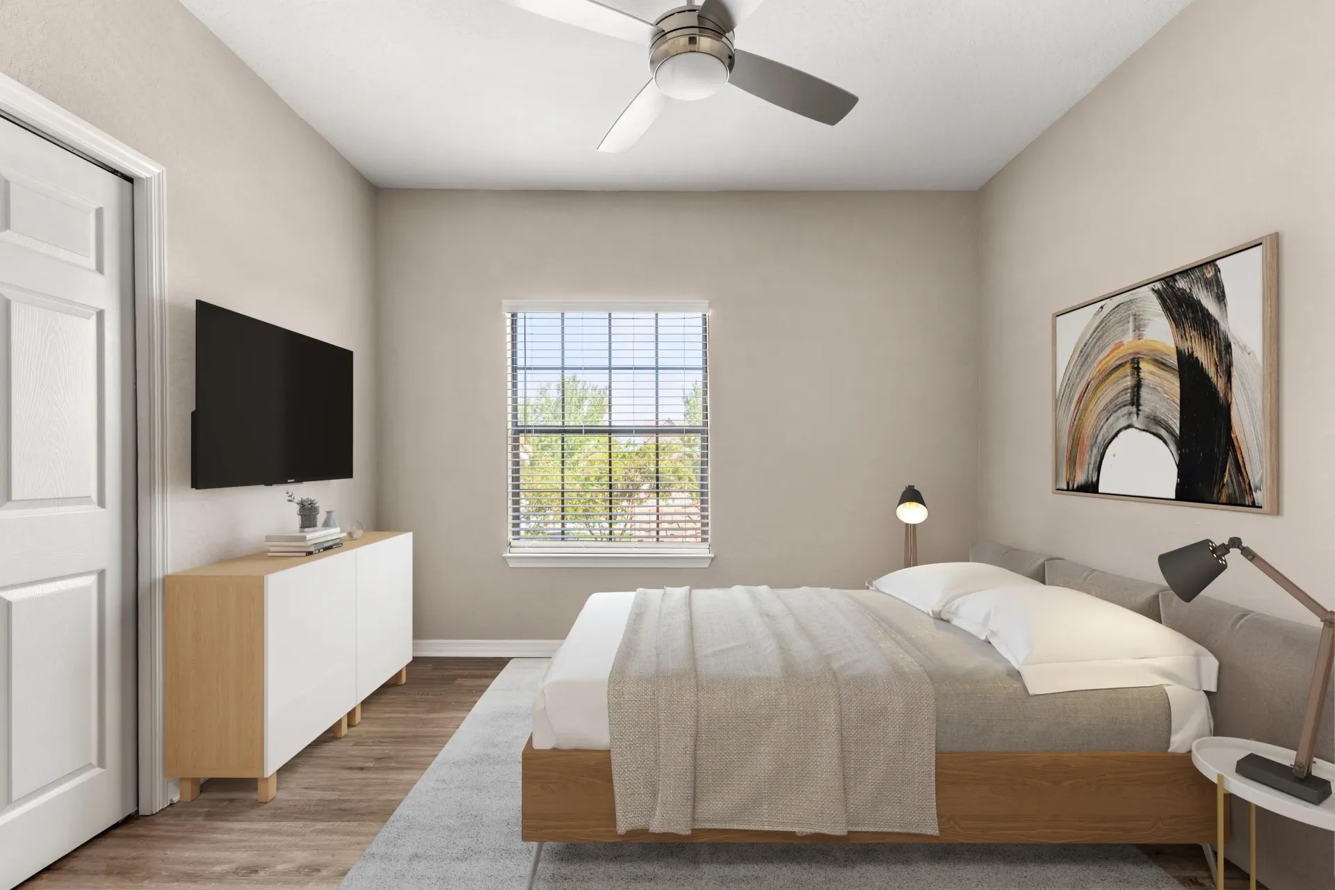 A bedroom with a bed, a television, a window, and a painting on the wall.