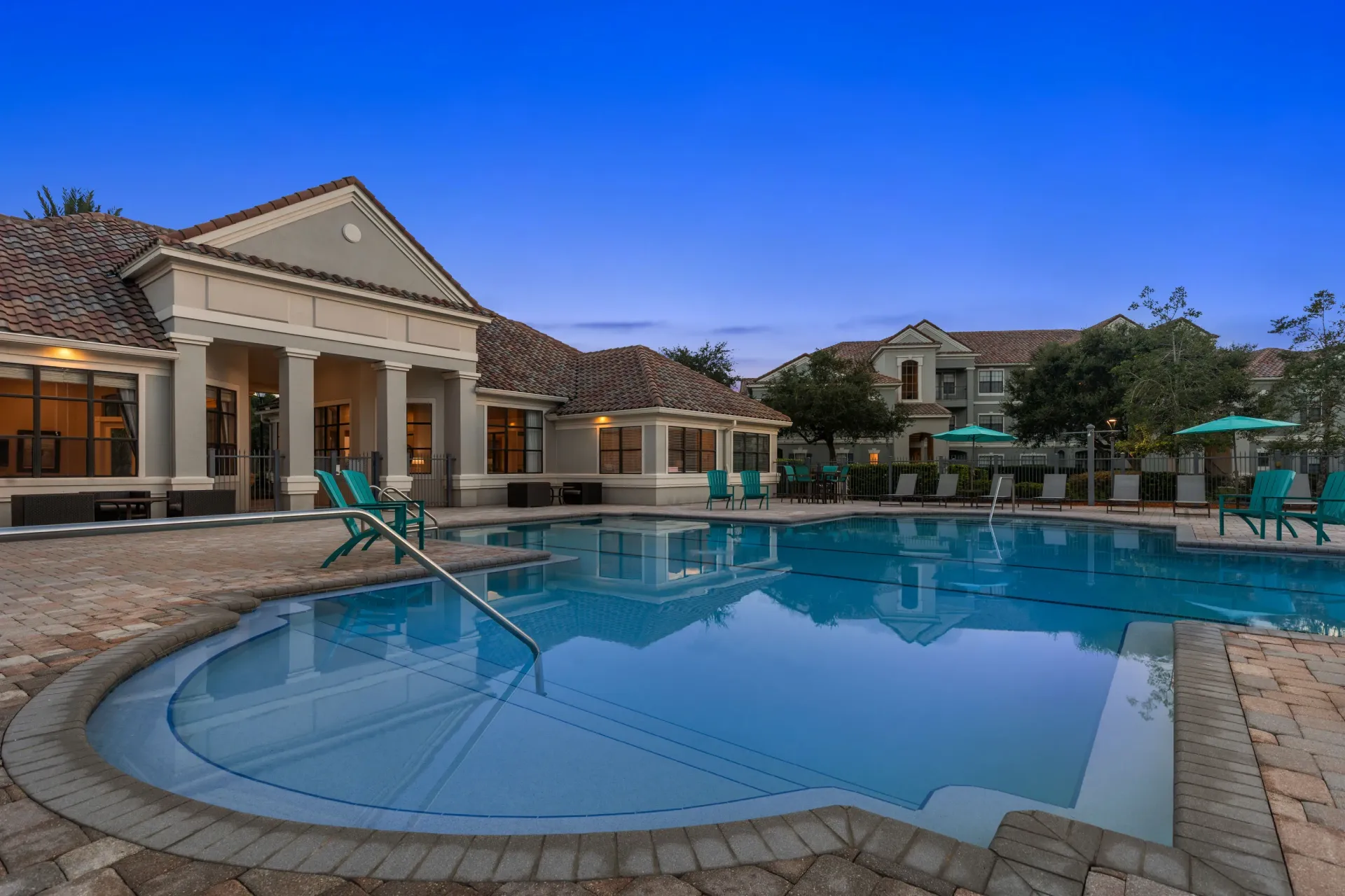 A large house with a pool in the backyard.