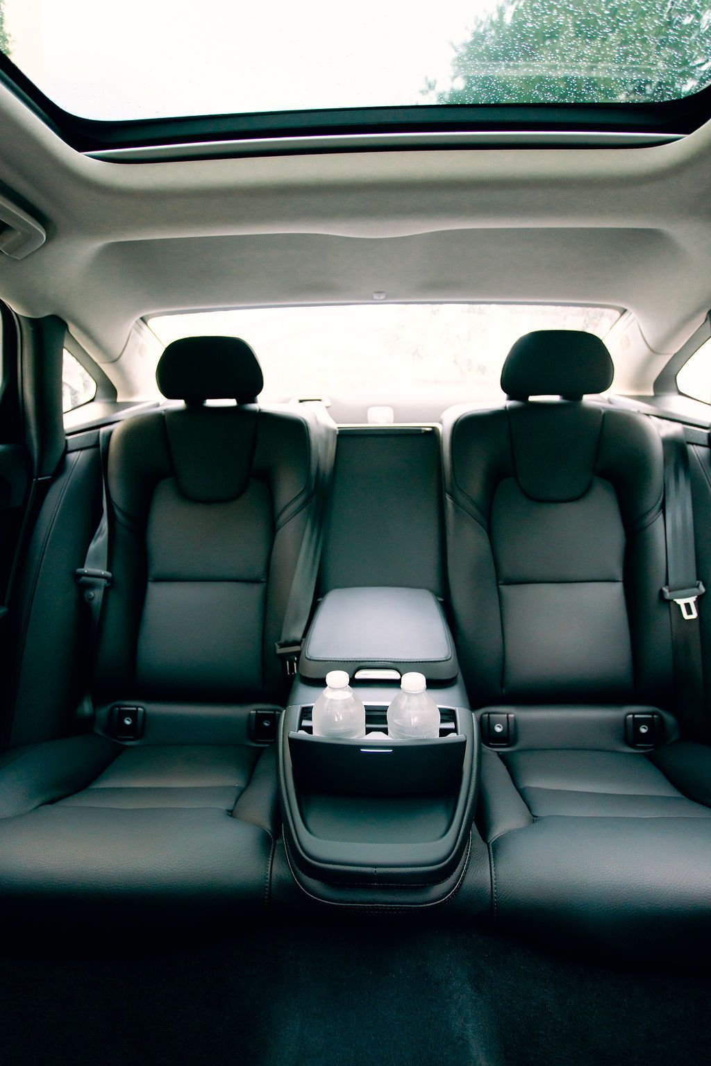 The interior of a car with a steering wheel and dashboard.